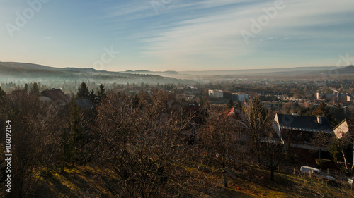 cloudy misty morning sunbeam in Budakeszi, Hungary, fall weather in January photo