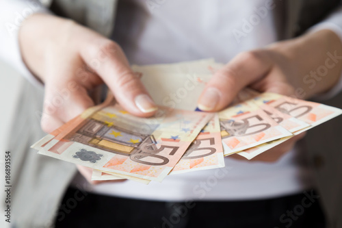 Woman's hands counting a money. Euro banknotes.