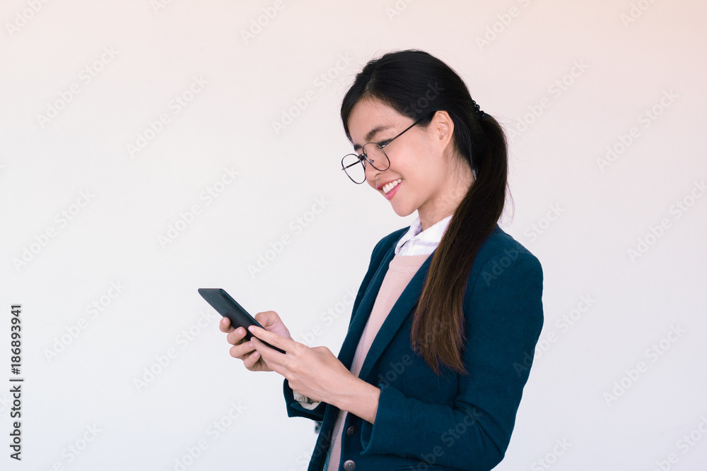 Young asian woman checking on her tablet Young asian woman checking on her tablet