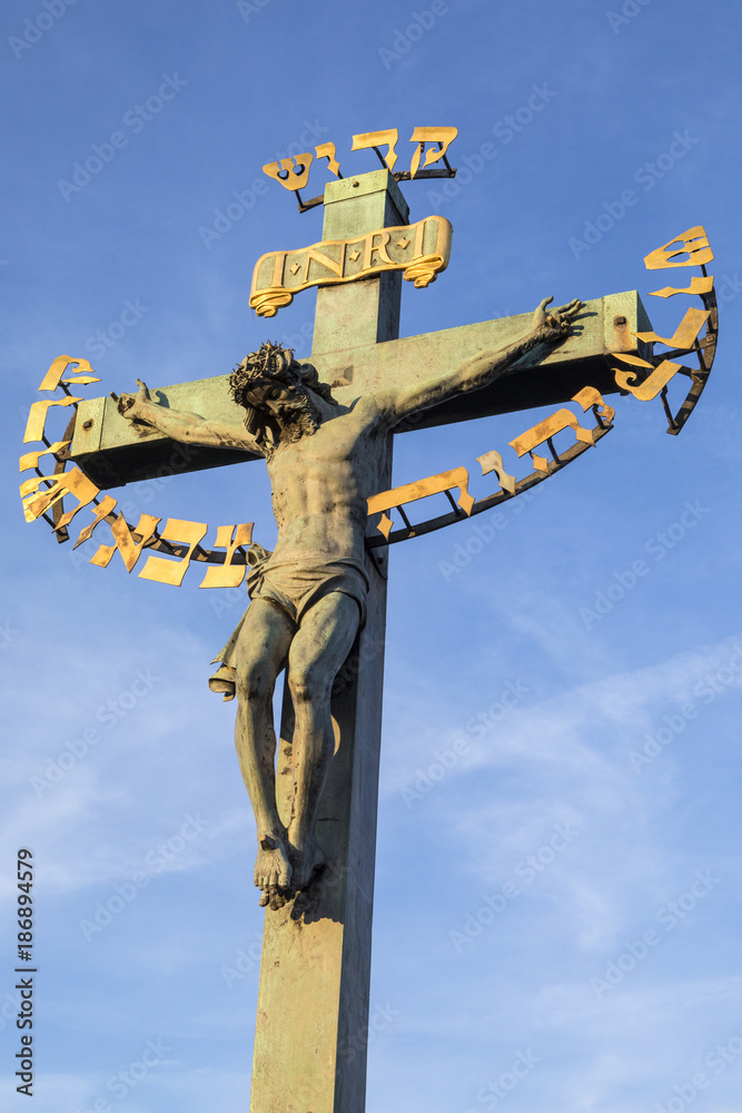 Crucifix Statue on the Charles Bridge in Prague Crucifix Statue on the Charles Bridge in Prague