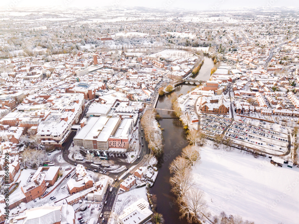 Aerial view of snowy historic English town, Shrewsbury. 1100 year old Market Town in England is covered in snow at Christmas