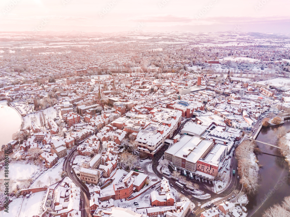 Aerial view of snowy historic English town, Shrewsbury. 1100 year old Market Town in England is covered in snow at Christmas