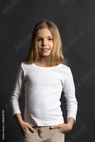 Child model with long hair in white shirt