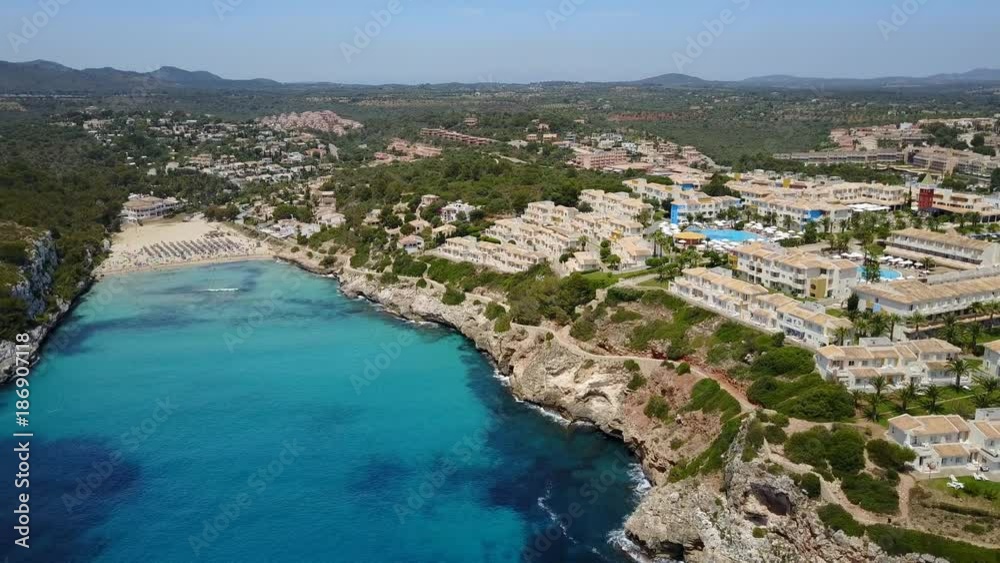 Drone aerial landscape of the beautiful bay of Cala Estany d'en Mas with a wonderful turquoise sea, Cala Romantica, Porto Cristo, Majorca, Spain Drone aerial landscape of the beautiful bay of Cala Estany d'en Mas with a wonderful turquoise sea, Cala Romantica, Porto Cristo, Majorca, Spain