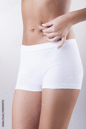 Picture of female model with perfect body. No adipose tissue.