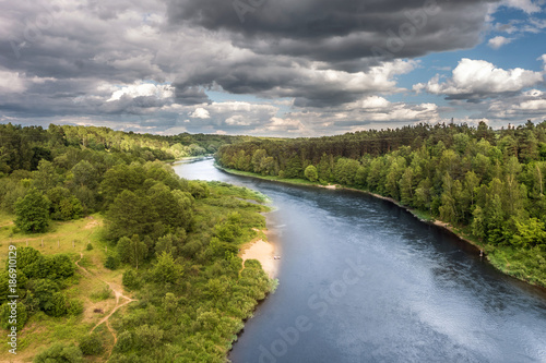 Panorama view near beautiful river with nice clouds.