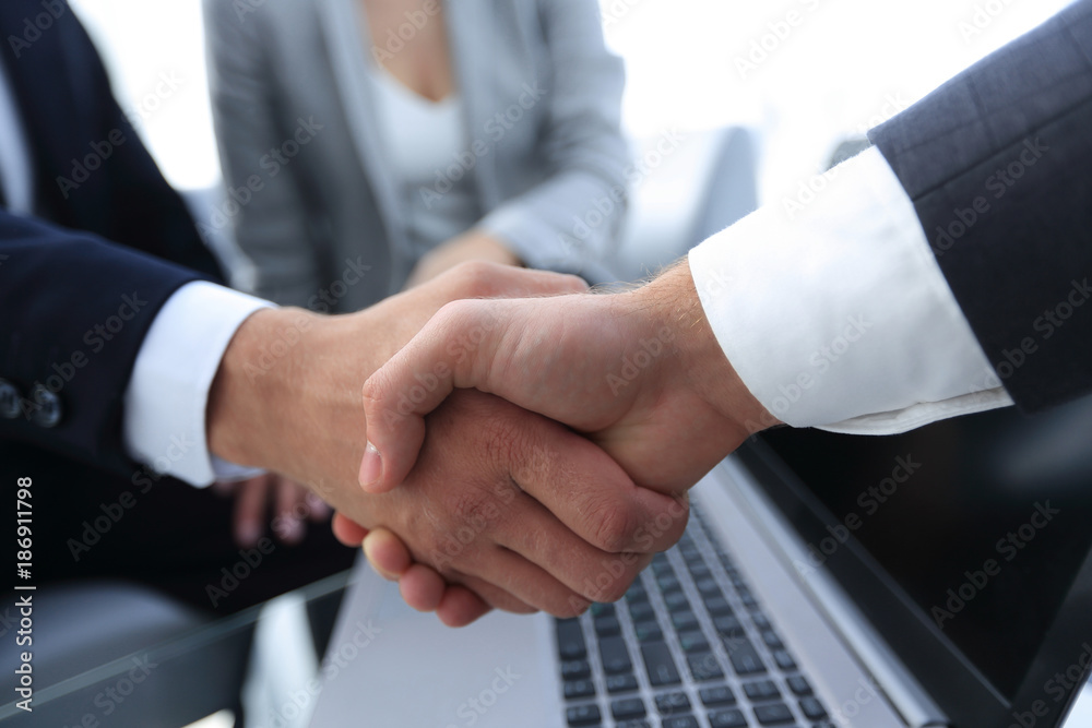 Two confidence businessman shaking hands close-up Two confidence businessman shaking hands close-up
