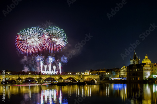 Colorful fireworks over Charles bridge and the river Vltava. The historical center of Prague. The Czech Republic.