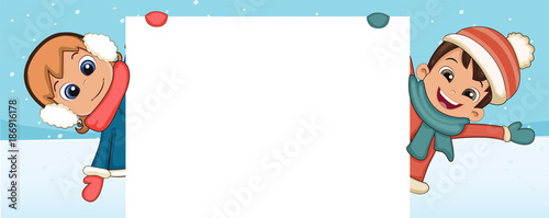 Kids in winter clothes holding blank board