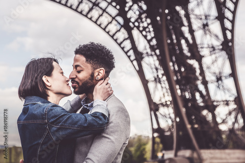 Multi-ethnic Couple Having Fun In Paris Near Eiffel Tower © nullplus