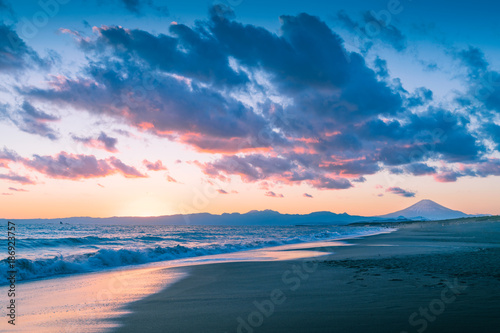 Mountain Fuji and sea wave in sunset at Shonan Coast,Kanagawa prefecture,Japan photo