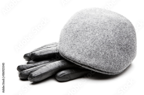 Photography Tweed grey cap black leather gloves white background