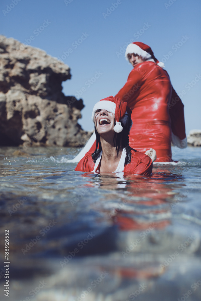 Couple in bed. Beautiful sexy Santa Clause in elegant panties, hat. Fashion  portrait of model girl indoors with Christmas couple. Female ass in  underwear. Naked body. Adult. Passionate. Stock Photo | Adobe