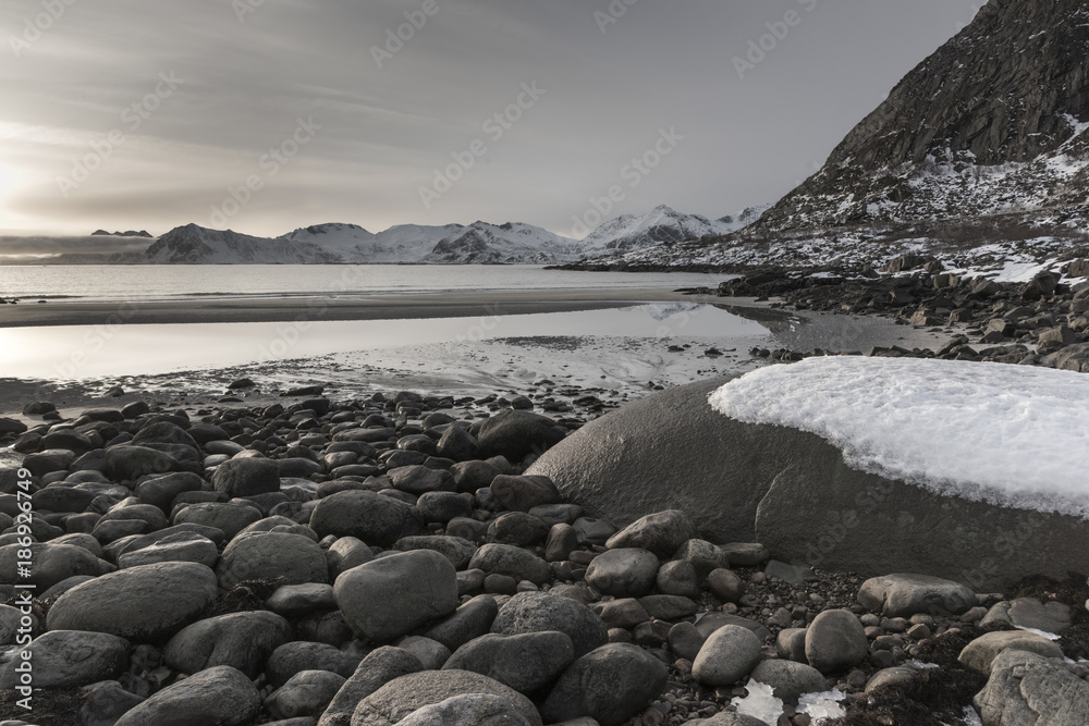 Rocks on beach during sunset, Lofoten, Nordland, Norway Rocks on beach during sunset, Lofoten, Nordland, Norway