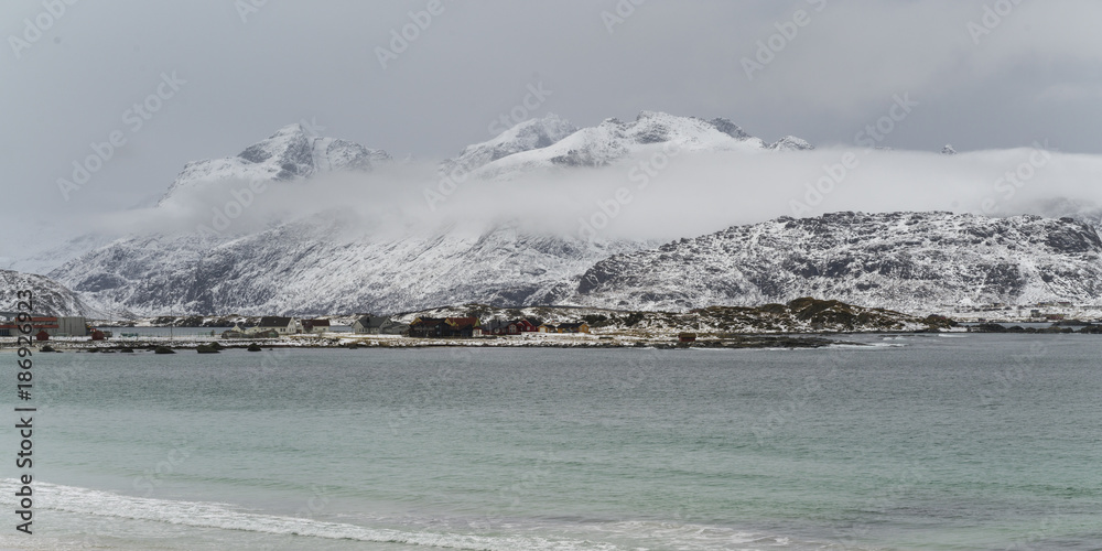 Sea with mountain range in the background, Lofoten, Nordland, Norway