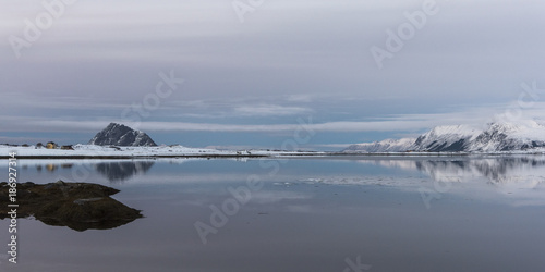 View of sea with mountain range in the background, Lofoten, Nordland, Norway