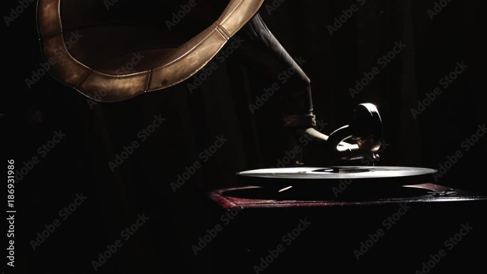 Old gramophone playing disc closeup.
