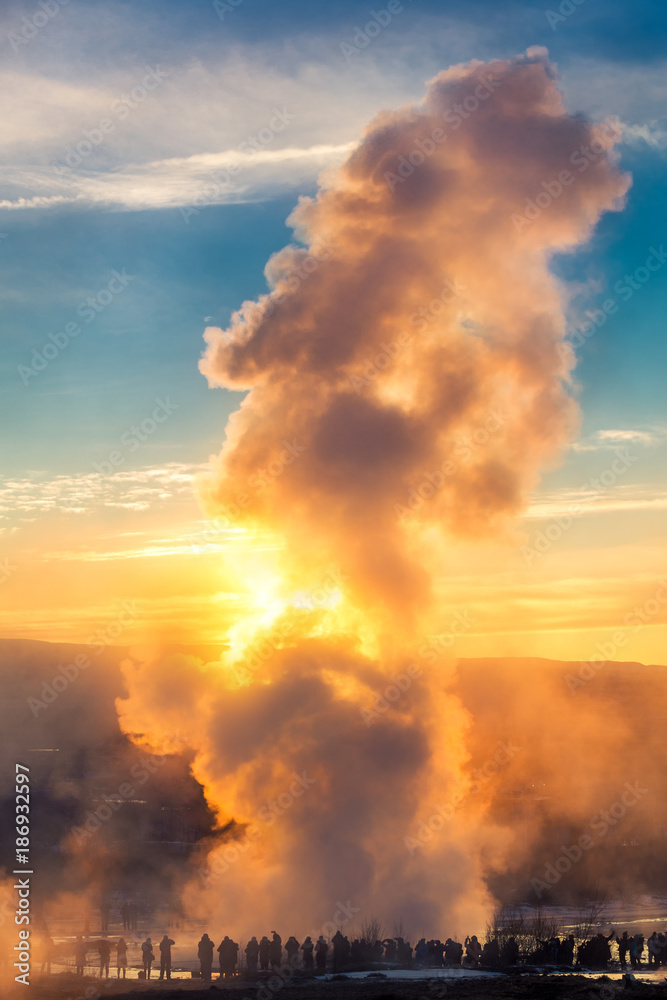 Strokkur geyser erupts at sunrise. Strokkur is one of Iceland's most famous geysers, erupting once every 6–10 minutes. Its column can reach 40 m high.