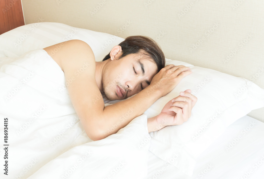 Closeup man sleeping on bed, health care and medical concept, selective focus Closeup man sleeping on bed, health care and medical concept, selective focus