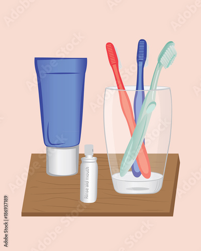 A glass and toothbrushes