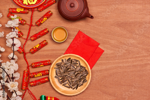 Flat lay Chinese new year new year table top shot. Toddler stealing food from table.