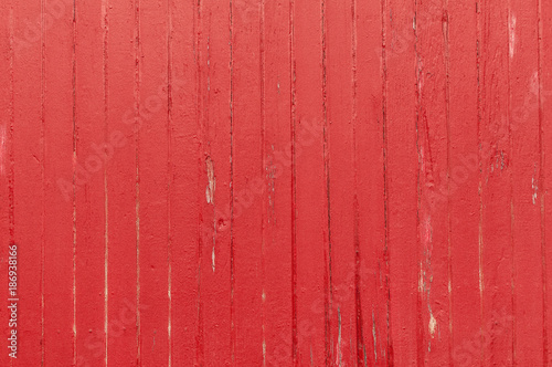 Weathered and textured wood painted red