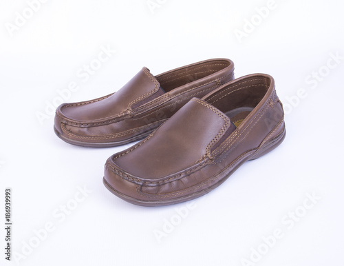 shoe or brown color men's shoes on a background. © heinteh