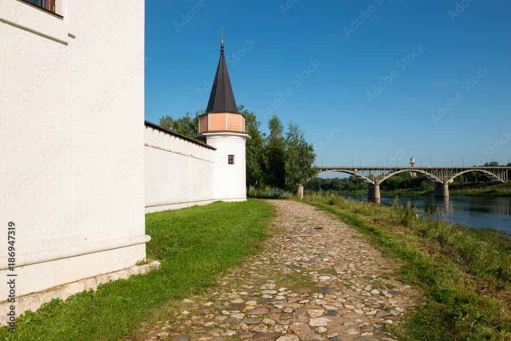 Fortress wall and tower in Ensemble of the Starytsky Svyato-Uspensky Monastery in city Staritsa, Tver region
