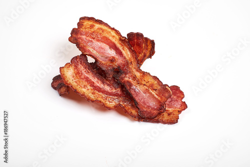 crispy fried bacon isolated on a white background.