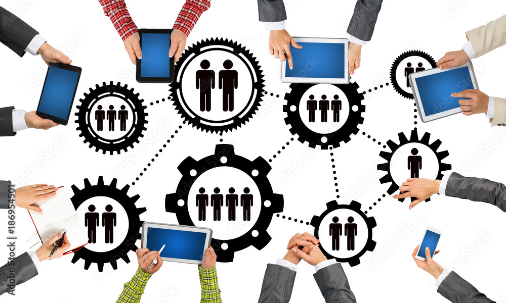 Top view of businesspeople sitting at table and using gadgets Top view of businesspeople sitting at table and using gadgets