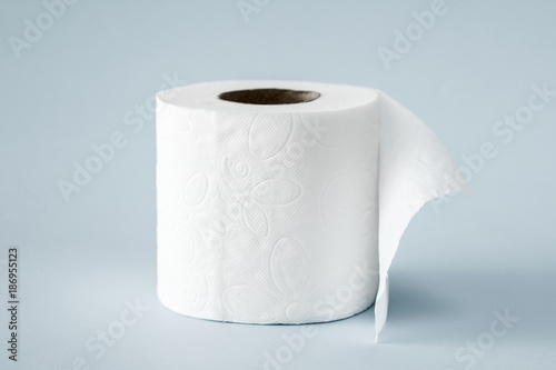 White roll toilet paper on the  light blue background