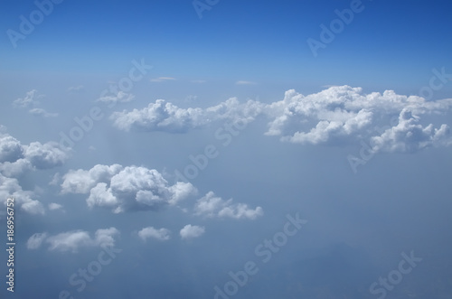 Cloudscape seen from an airplane during flight above the clouds