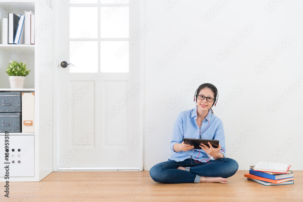 smiling happy woman student holding mobile pad smiling happy woman student holding mobile pad