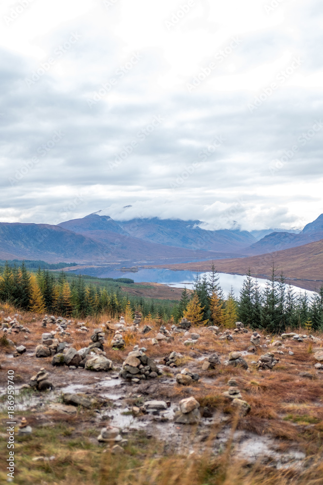 Fototapeta premium Scenic Landscape View of Mountain, Forest and Lake in Scottish Highlands.