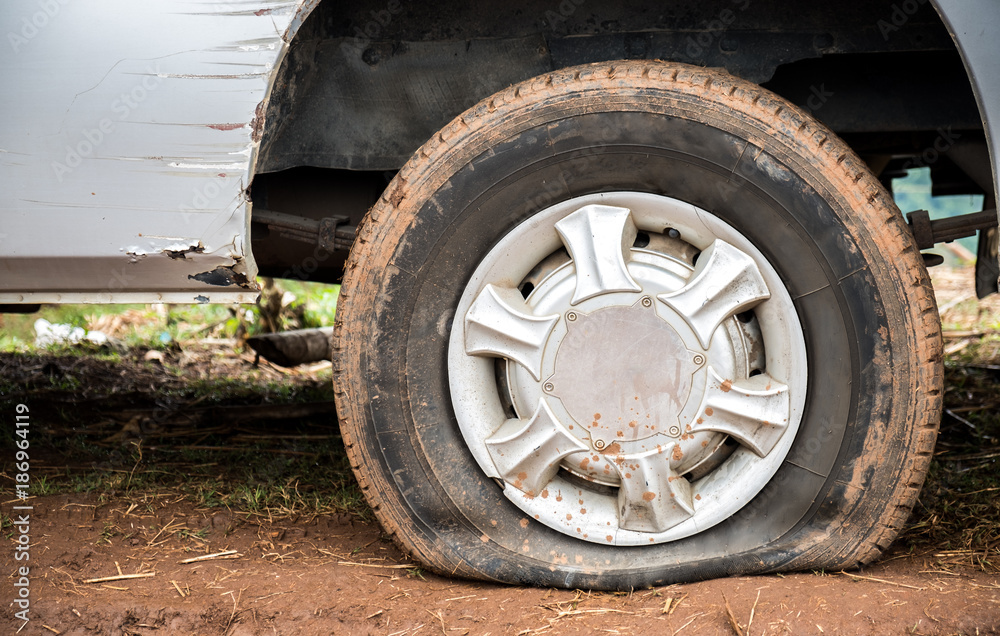 Flat tire on mud road