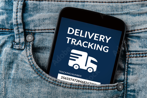 Delivery tracking concept on smartphone screen in jeans pocket. All screen content is designed by me. Flat lay