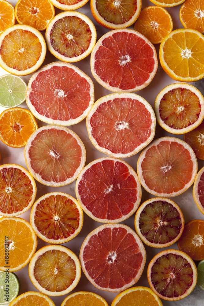 Halves of different citrus fruits Halves of different citrus fruits
