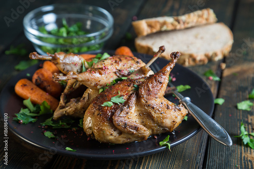 Fried quail with carrots and fresh parsley