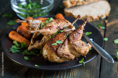 Fried quail with carrots and fresh parsley