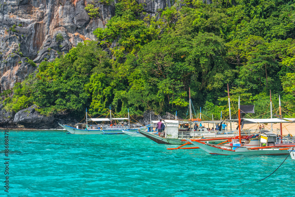 El Nido bay scenic islands view with bangka boats, Palawan, Philippines El Nido bay scenic islands view with bangka boats, Palawan, Philippines
