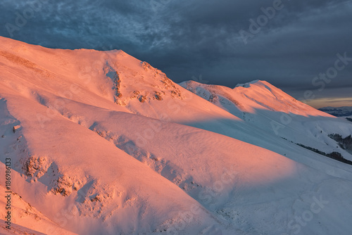 Italy, Umbria, Monti Sibillini National Park, Sunset on mountain Redentore in Winter