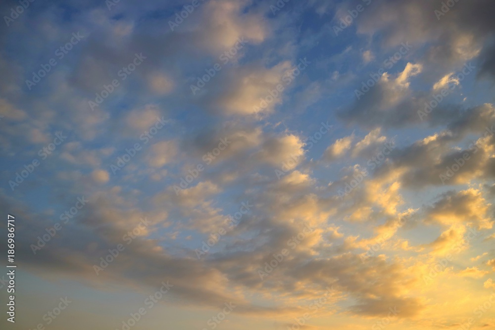 Beautiful blue sky with colorful cloud with sunlight in the evening. Soft focus. Nature background concept. 