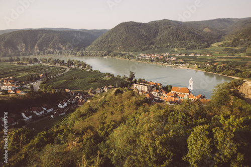 Austria, Wachau, Duernstein, Duernstein monastery with blue spire at Danube river photo