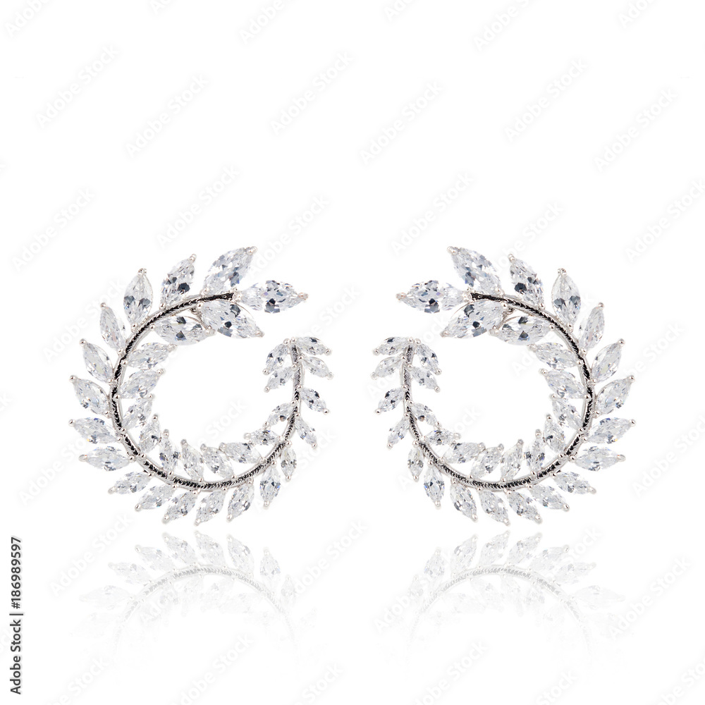 Pair of diamond earrings isolated on white