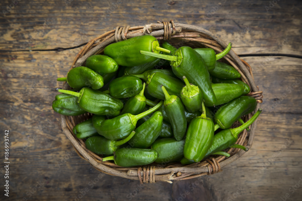 Wicker basket of Pimientos de Padron Wicker basket of Pimientos de Padron