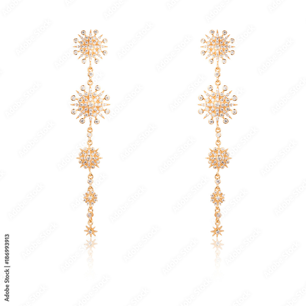 Pair of golden diamond earrings isolated on white Pair of golden diamond earrings isolated on white