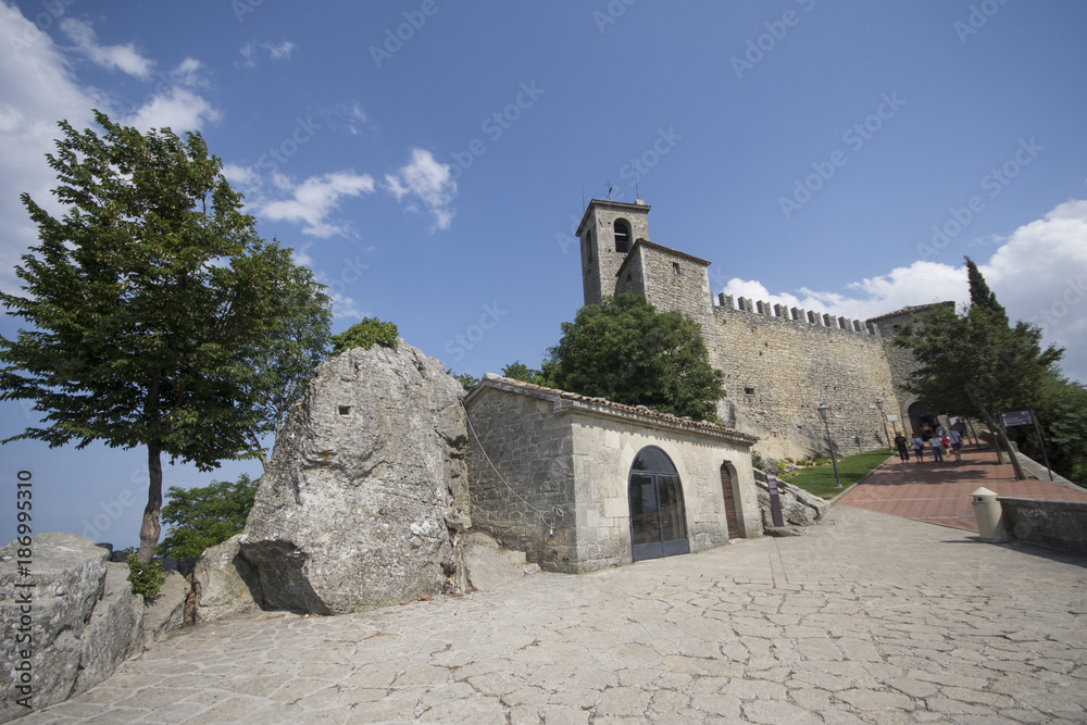 View of Guaita fortress (or First Tower) on top of Monte Titano in San Marino, and the surrounding hills. June, 2017