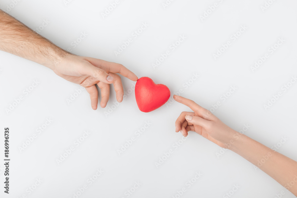 top view of hands touching red heart isolated on white background Stock  Photo | Adobe Stock