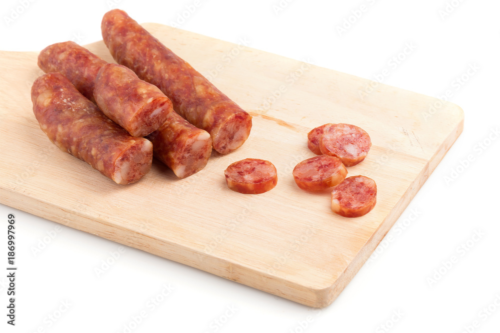 Chinese sausage and chinese sausage sliced for cook isolated on a white background