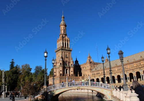 Beautiful view of the bell tower and the bridge in the square (Plaza de Espana)/ Seville, Spain
